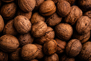 Textured pile of walnuts in closeup view