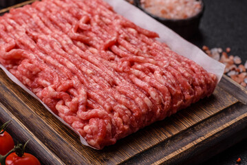 Raw ground beef or pork, prepared meat for burgers or other food preparation. Raw ground beef