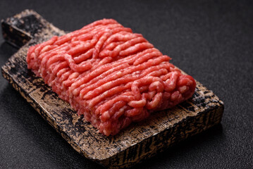 Raw ground beef or pork, prepared meat for burgers or other food preparation. Raw ground beef