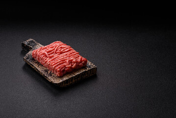 Raw ground beef or pork, prepared meat for burgers or other food preparation. Raw ground beef