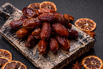 Dried dates in a ceramic plate, arabic food for the ramadan table. Dried dates as a food backgrounds