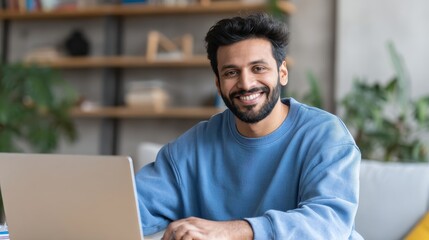 smiling indian business man working on laptop at home office young indian student or remote teacher using computer remote studying virtual training watching online education webinar at home office no