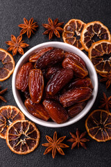 Dried dates in a ceramic plate, arabic food for the ramadan table. Dried dates as a food backgrounds