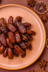Dried dates in a ceramic plate, arabic food for the ramadan table. Dried dates as a food backgrounds