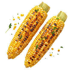 Two yellow corn cobs with a sprinkle of parsley on top