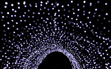 Illuminated archway with glowing lights forming a stunning nighttime display