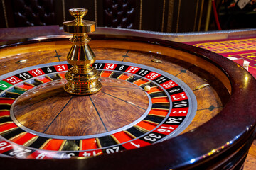 Roulette wheel. Casino. Gambling game. Roulette wheel on table in a casino. Roulette. The game in the casino. The concept of expectation of good luck.