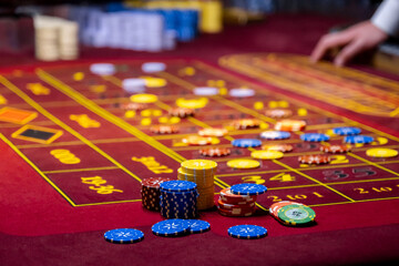 Close up of a Roulette Table. People play poker in the casino. Croupier behind gambling table in a casino © NastyaPhoto