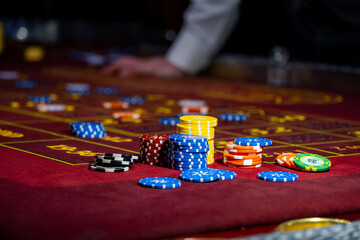 Casino poker money chips texture. Stack of poker chips as background. Casino felt table with numbers. Stack of poker chips.