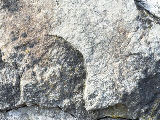 Close-up of weathered rough rock surface with natural texture
