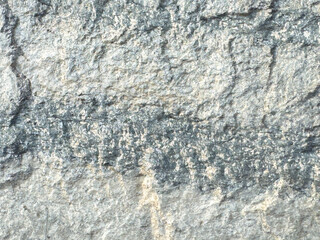 Textured gray rock surface with natural rough patterns and details