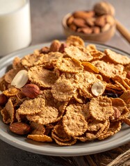 A plate of cereal topped with nuts