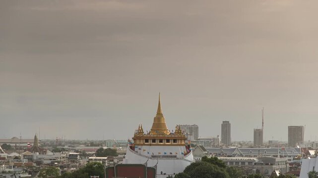 Time lapse of Golden Mount Temple (wat saket rajavaravihara) at sunset, bangkok, thailand, Asia, landmark and famous place of Thailand