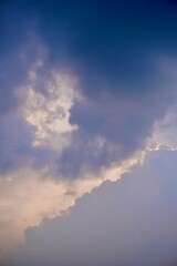 Dramatic storm clouds glowing with sunset light