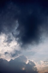 Massive storm cloud formation with glowing silver edges