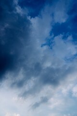 Dark blue clouds stretching across the evening horizon