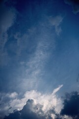 blue sky with layered clouds