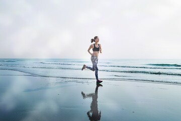 A woman is running at the beach