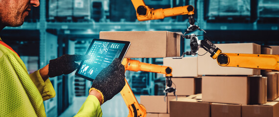Smart robot arm systems for innovative warehouse and factory digital technology . Automation manufacturing robot controlled by industry engineering using IOT software connected to internet network .