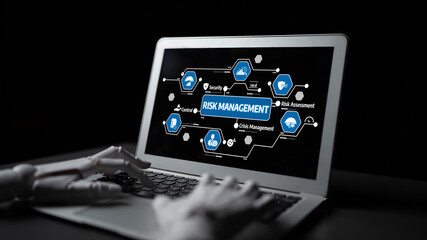 This image showcases a laptop displaying risk management concepts with a robotic hand, emphasizing technology role in enhancing business security and analysis. Tessel