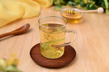warming drink linden blossom tea on the table close-up