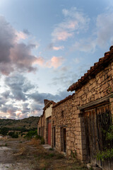 Pink clouds over the village of Mora de Rubielos at sunset, Teruel, Aragon, Spain