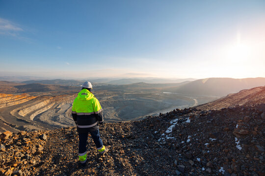Open Pit Mining Engineer Overlooking industry Quarry of ore, industrial Landscape