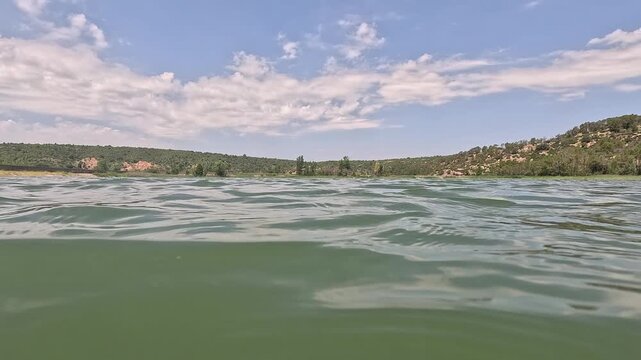 Rowing on the Valbona reservoir in Teruel, Aragon, Spain in summer