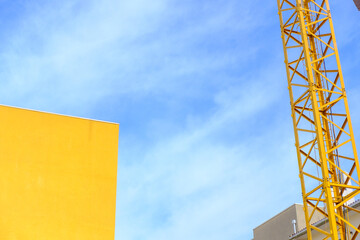 Minimalist Composition with a Yellow Crane and Building The Concept of a Modern Architecture