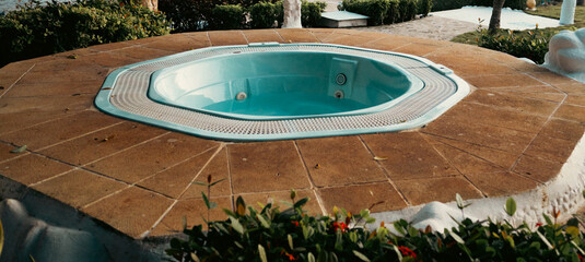 Inviting hot tub surrounded by lush landscaping inviting relaxation and leisure.