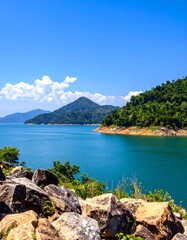 Scenic lake view, mountains and clouds
