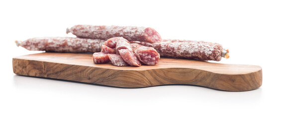 Sliced fuet sausage with mold isolated on white background.