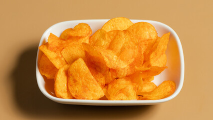 Potato chips in bowl isolated