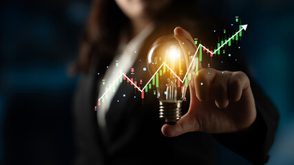 A stock market trading candlestick chart showing a bull market trend. A concept of financial...