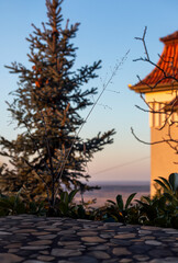 A backdrop with stone terrace and sunset sky for product placement