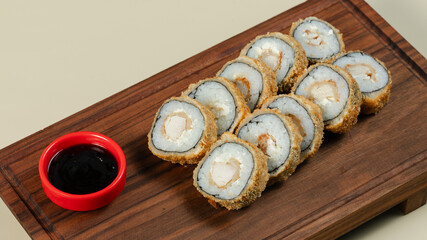 Hot sushi with soy sauce on tray