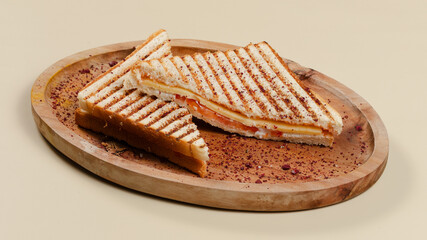 Sliced club sandwich on wooden tray