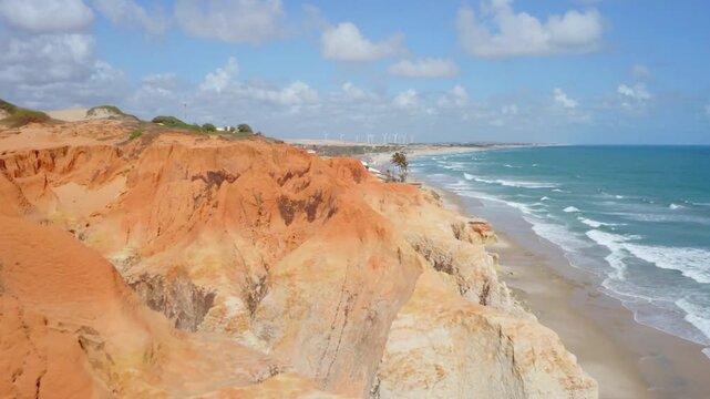 A scenic coastline with cliffs and beaches in cear, brazil, is captured from above