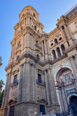 Fototapeta premium Morning walk through the quiet streets of Malaga, Spain, with soft sunlight and calm city atmosphere.