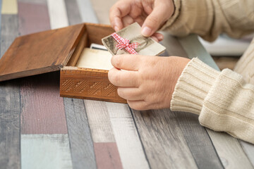 set Vintage empty photographs in female hand, Tracing family roots through images, journey into ancestry, family history and heritage, nostalgia antique artwork, family ties, memories childhood