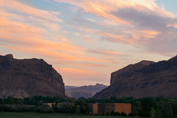 Scenic view of cliffs under twilight sky illuminated by soft pastel colors.