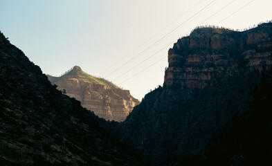 Charming mountain peaks partially illuminated by soft light in the morning.