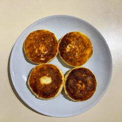 Preparing bread dough at home on a floured kitchen surface, ready for baking.