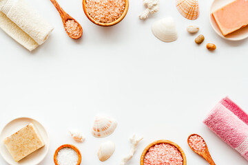 Essential oil and spa cosmetic products with sea shells, top view. Beauty spa therapy cosmetics and wellness background