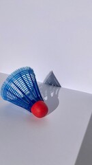 badminton shuttlecock with an abstract shadow