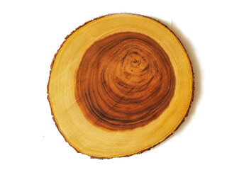 Luxurious wooden cutting board on white background. Round shape kitchen tool with yellow and rich brown color tone. Woodcraft product with high quality finish.