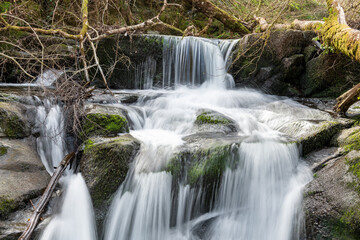 Long exposure of a waterfall on the Hoar Oak Water river at Watersmeet in Exmoor National Park