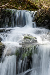 Long exposure of a waterfall on the Hoar Oak Water river at Watersmeet in Exmoor National Park