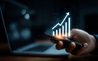 Smartphone Displaying Growth Chart with Laptop in Background