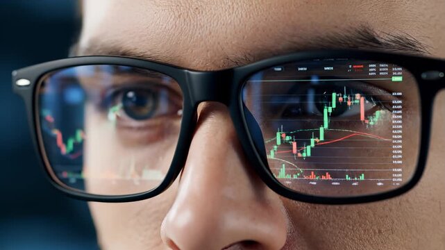 A person's face with glasses, reflecting a futuristic financial data chart on the lenses.